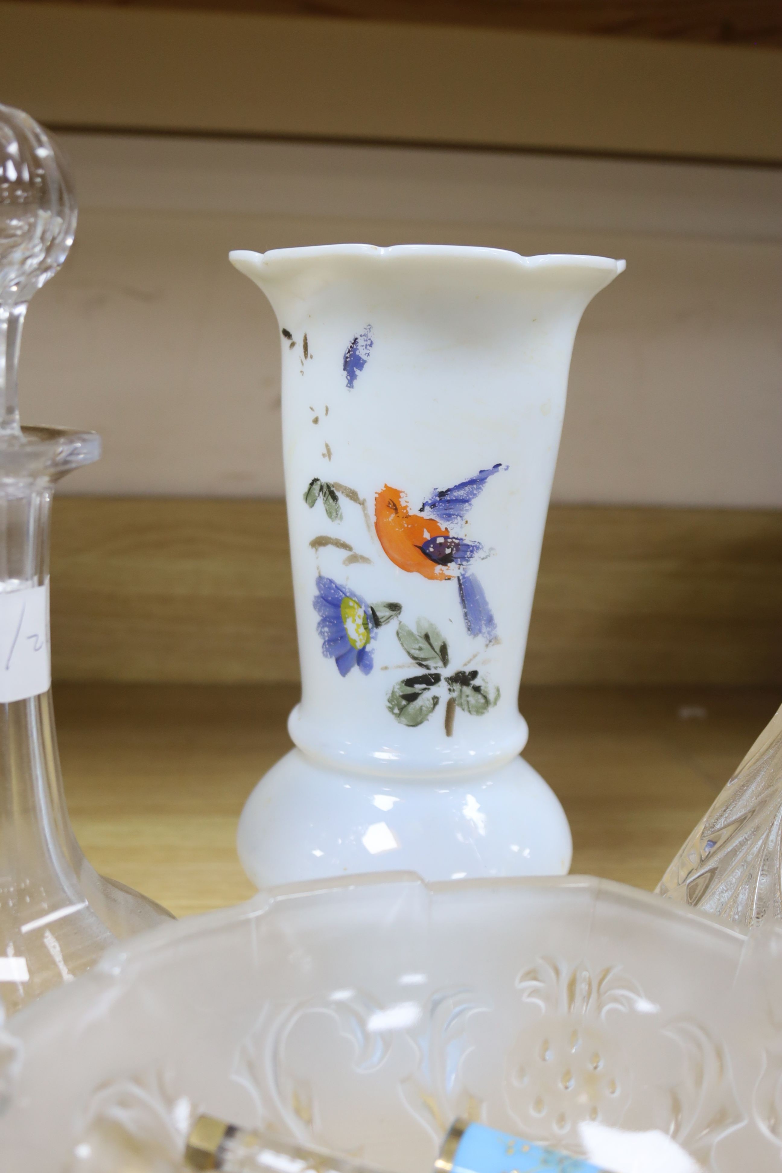 A collection of glass perfume bottles, three decanters, two scent bottles with cut glass stoppers and two handled bowl and an Art Nouveau style vase and plated cruet